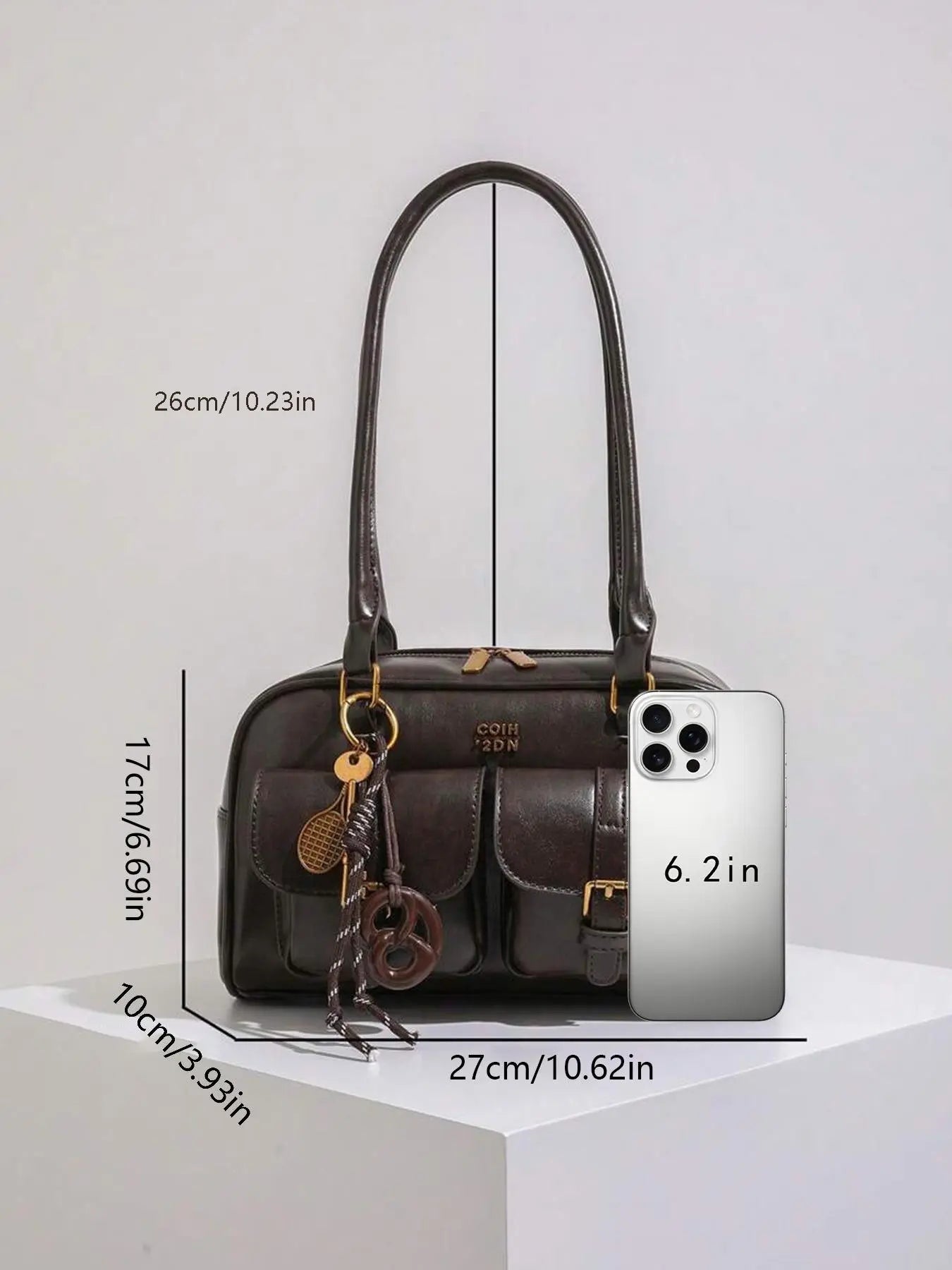 Retro style double pocket handbag, fashionable underarm shoulder bag with pendant, simple and versatile single shoulder baguette bag, niche design suitable for college students, office workers daily commuting, etc.